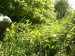 A slim blonde beauty from France gets two hard cock outdoors