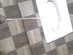 18 year old boy peeing with his big black cock