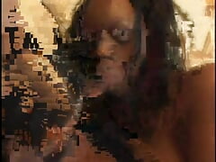 Two ebony honeys share one hard cock in front of the fireplace